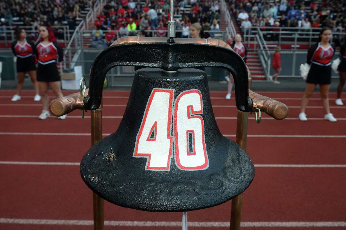 The iron bell with Ryan Rutledge’s No. 46 was dedicated before the Pomperaug High School football game in Southbury, Conn. Sept. 17, 2021.