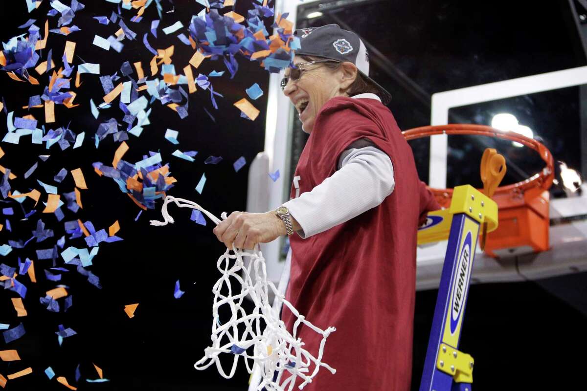 Stanford head coach Tara VanDerveer reacts as confetti flies after she helped cut down the net after Stanford beat Texas, 59-50, in the Elite 8 round of the NCAA tournament March 27 in Spokane, Wash.