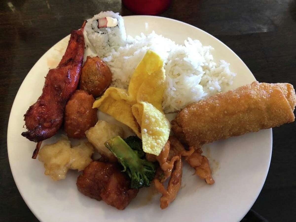 Pictured is a collection of chicken dishes, accompanied by rice, an egg roll, sushi and crab rangoon at Golden Buffet in Midland. 