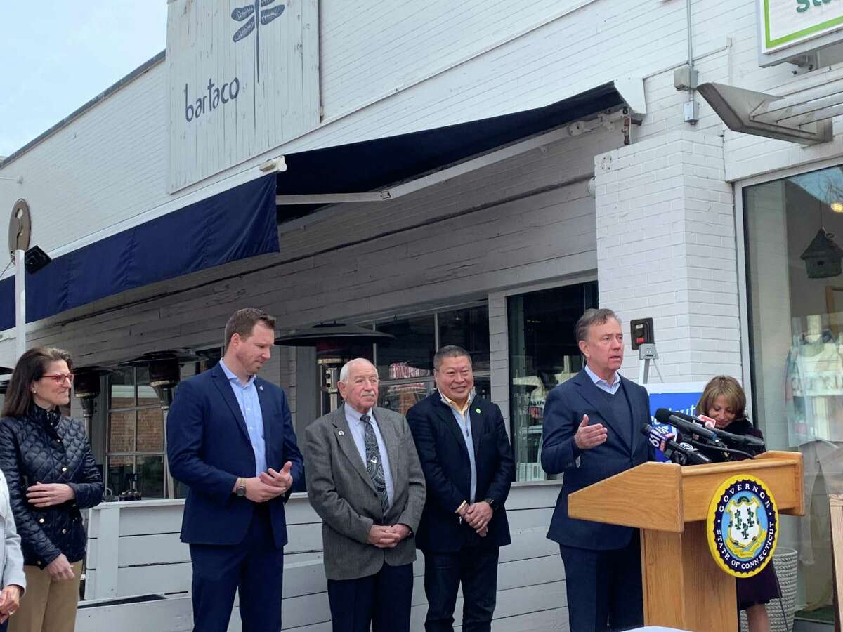 Gov. Ned Lamont speaks outside of bartaco on Farmington Avenue in West Hartford before signing a bill that expands the relaxation of outdoor dining in the state.