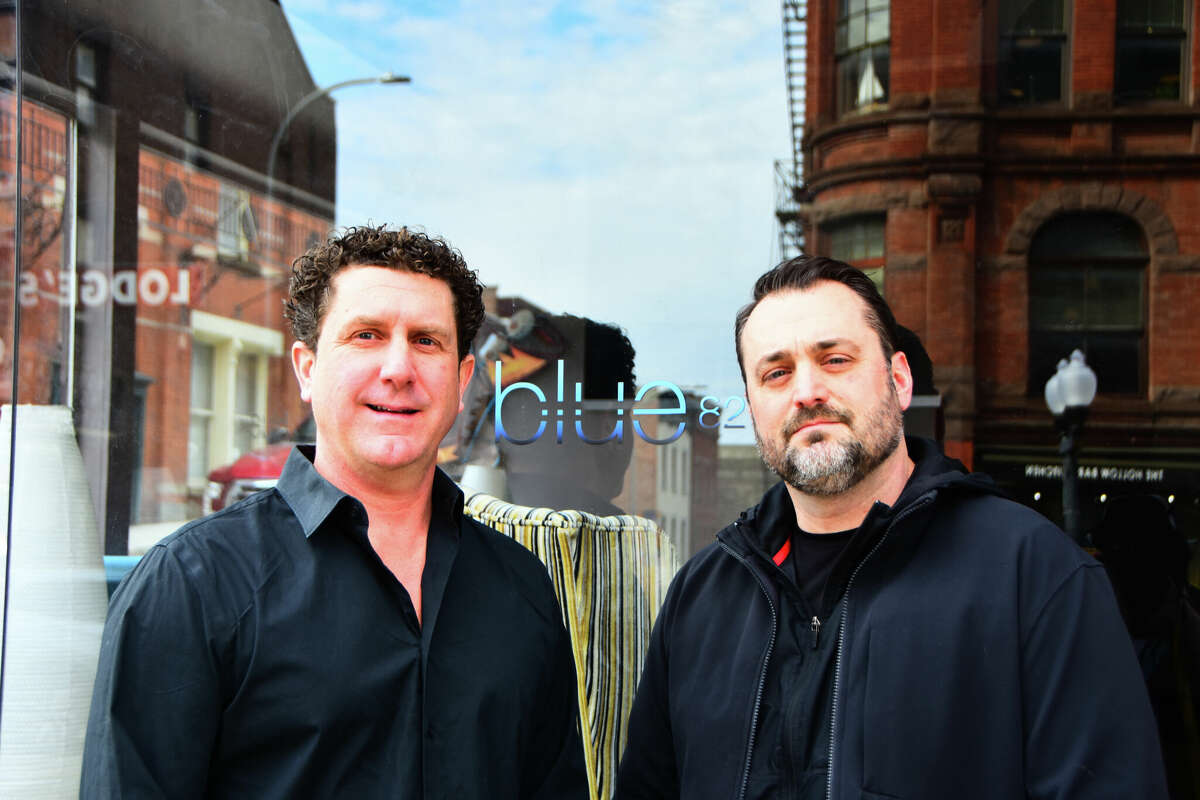 Blue 82 co-owners Jason Hayes, left, and Mike Ripley, in front of their bar and lounge on North Pearl Street in downtown Albany on March 30, 2022. It will close after service on April 1, six weeks shy of what would have been its 17th anniversary.