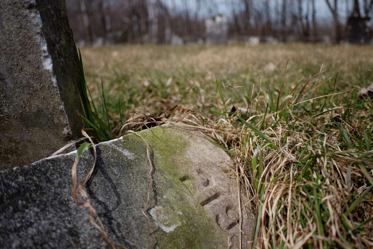 A view of the poor house cemetery on Wednesday, March 30, 2022, in Argyle, N.Y. Some of the graves have no names but only numbers on the marker. (Paul Buckowski/Times Union)