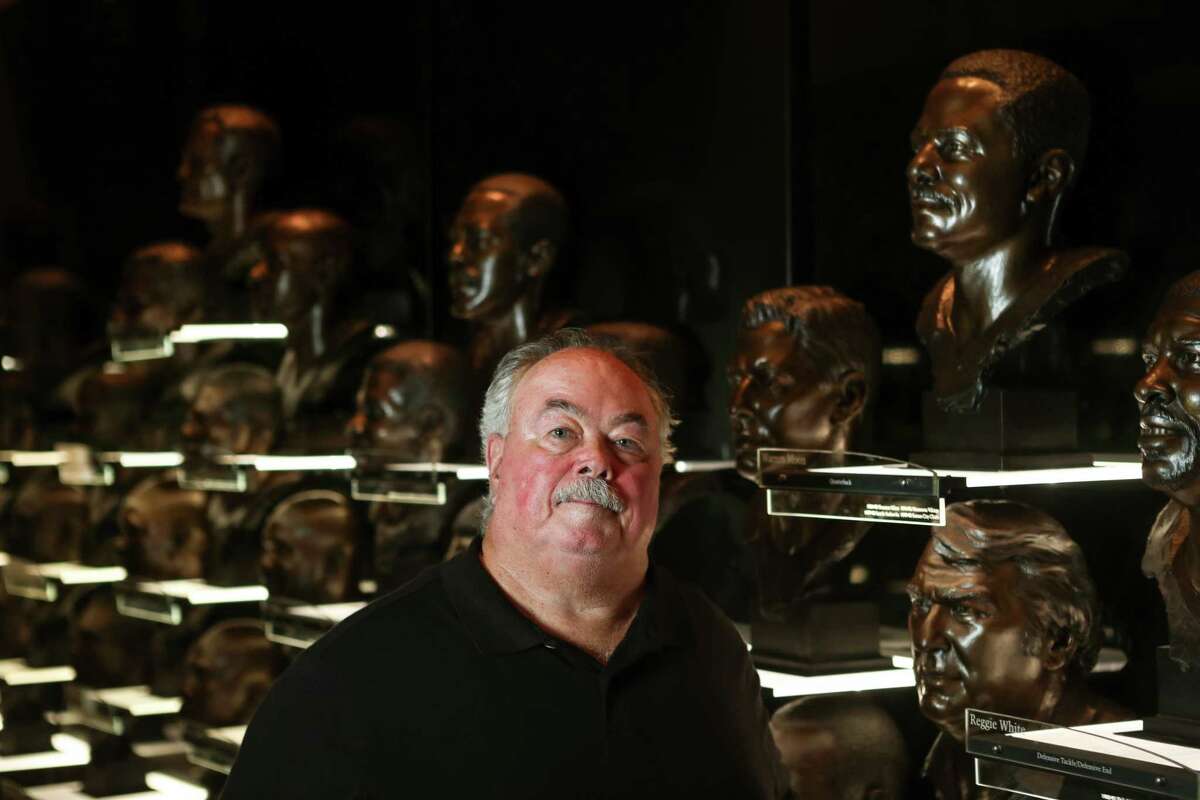 Houston Chronicle football writer John McClain poses for a portrait in the bust room at the Pro Football Hall of Fame Saturday, Sept. 18, 2021 in Canton, Ohio. McClain has covered the NFL, including the Oilers and Texans, for four-plus decades at the Chronicle. He also has a plaque in the Hall of Fame as the 2006 winner of the Dick McCann Memorial Award (now the Bill Nunn Memorial Award) for his long and distinguished coverage of the NFL. He's a member of the Pro Football Hall of Fame Selection Committee, the Pro Football Hall of Fame Seniors Committee and the Texas Sports Hall of Fame Selection Committee.