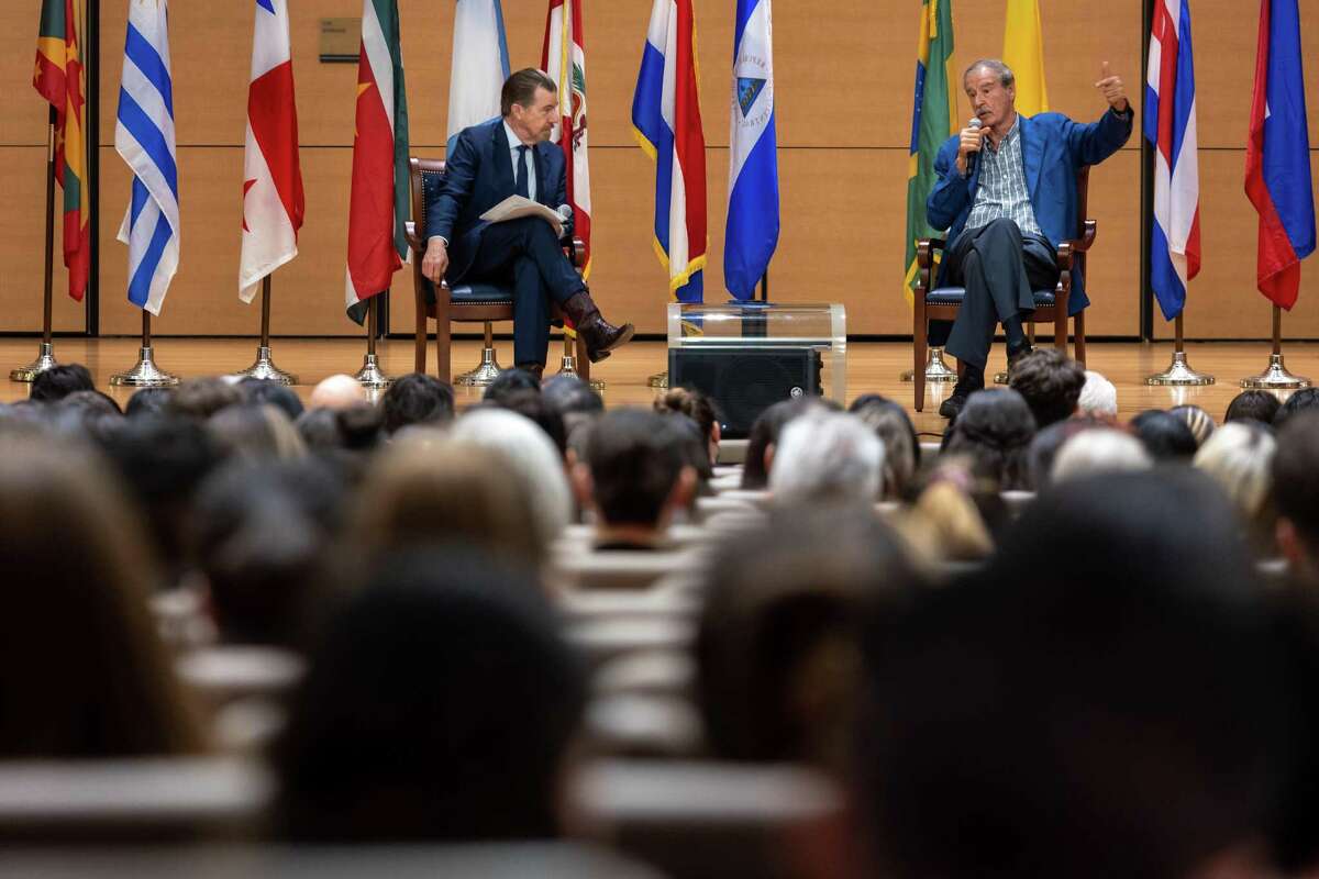 Secretary of Migration and Foreign Affairs Juan Hernandez, left, and former President of Mexico Vicente Fox talk during the first installment of the “Leaders of the Americas" lecture series at the Diane Bennack Concert Hall on the campus of University of the Incarnate Word in San Antonio, Texas, on March 30, 2022.