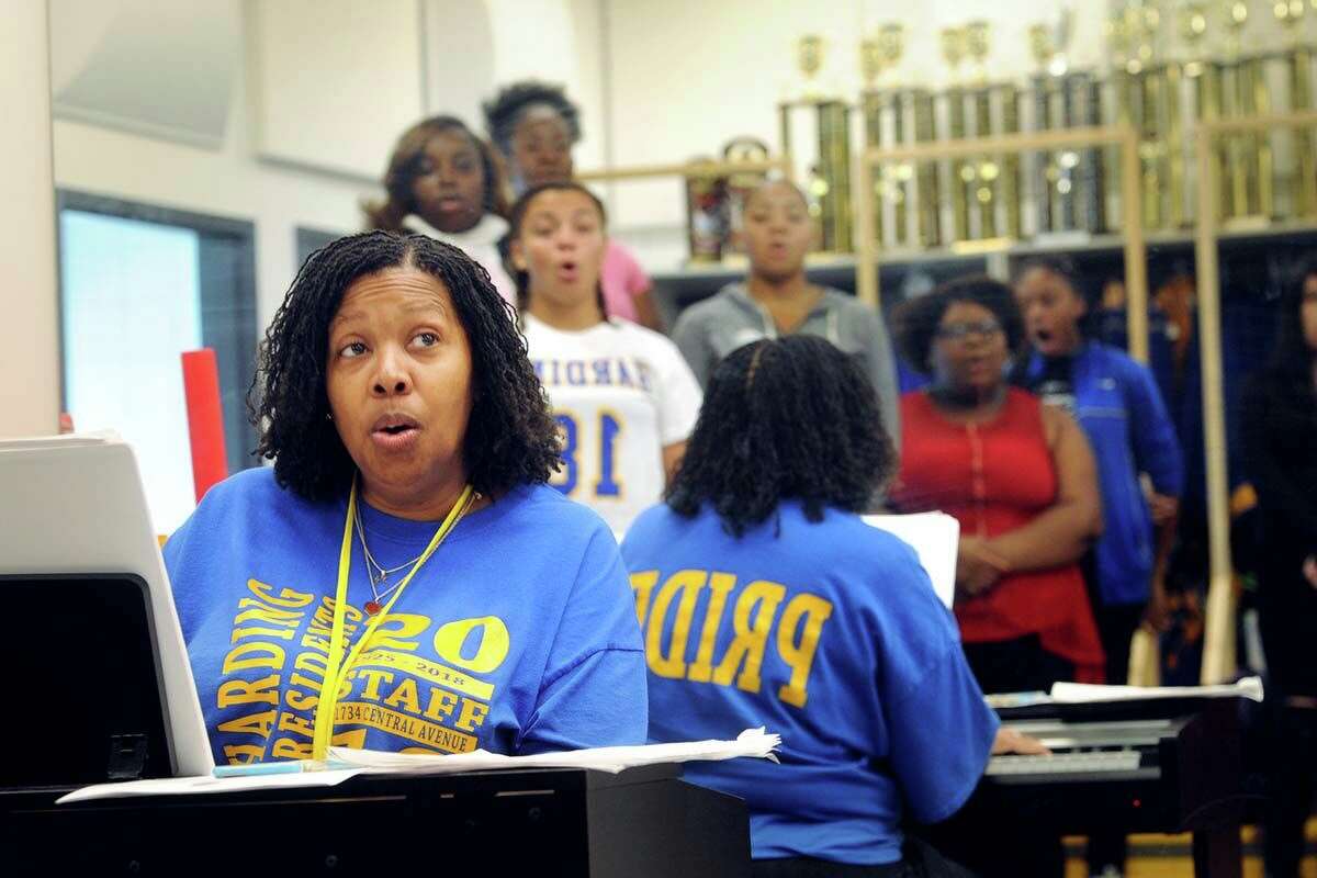 Sheena Graham, shown here leading choir practice at Harding High School in Bridgeport in 2018, was the 2019 Connecticut Teacher of the Year. Now, she says she retired early due to the stress of teaching in the current climate.