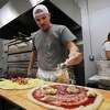 Owner Jim Ormrod makes the pizzas at the new Zuppardi's Slice Shop and Takeout Apizza at 58 Beaver Street in Ansonia, Conn. on Wednesday, February 3, 2022.