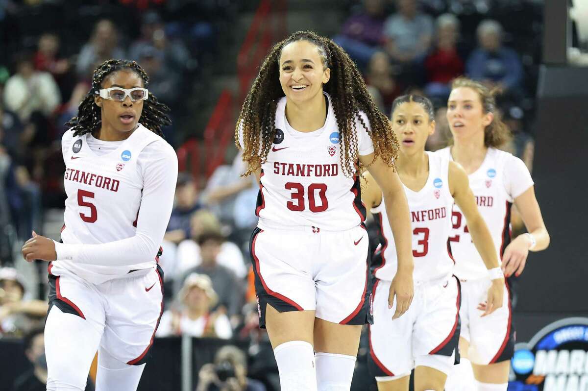 SPOKANE, WASHINGTON - MARCH 27: Haley Jones #30 of the Stanford Cardinal celebrates with teammates after a score during the second quarter against the Texas Longhorns in the NCAA Women's Basketball Tournament Elite 8 Round at Spokane Veterans Memorial Arena on March 27, 2022 in Spokane, Washington. (Photo by Abbie Parr/Getty Images)