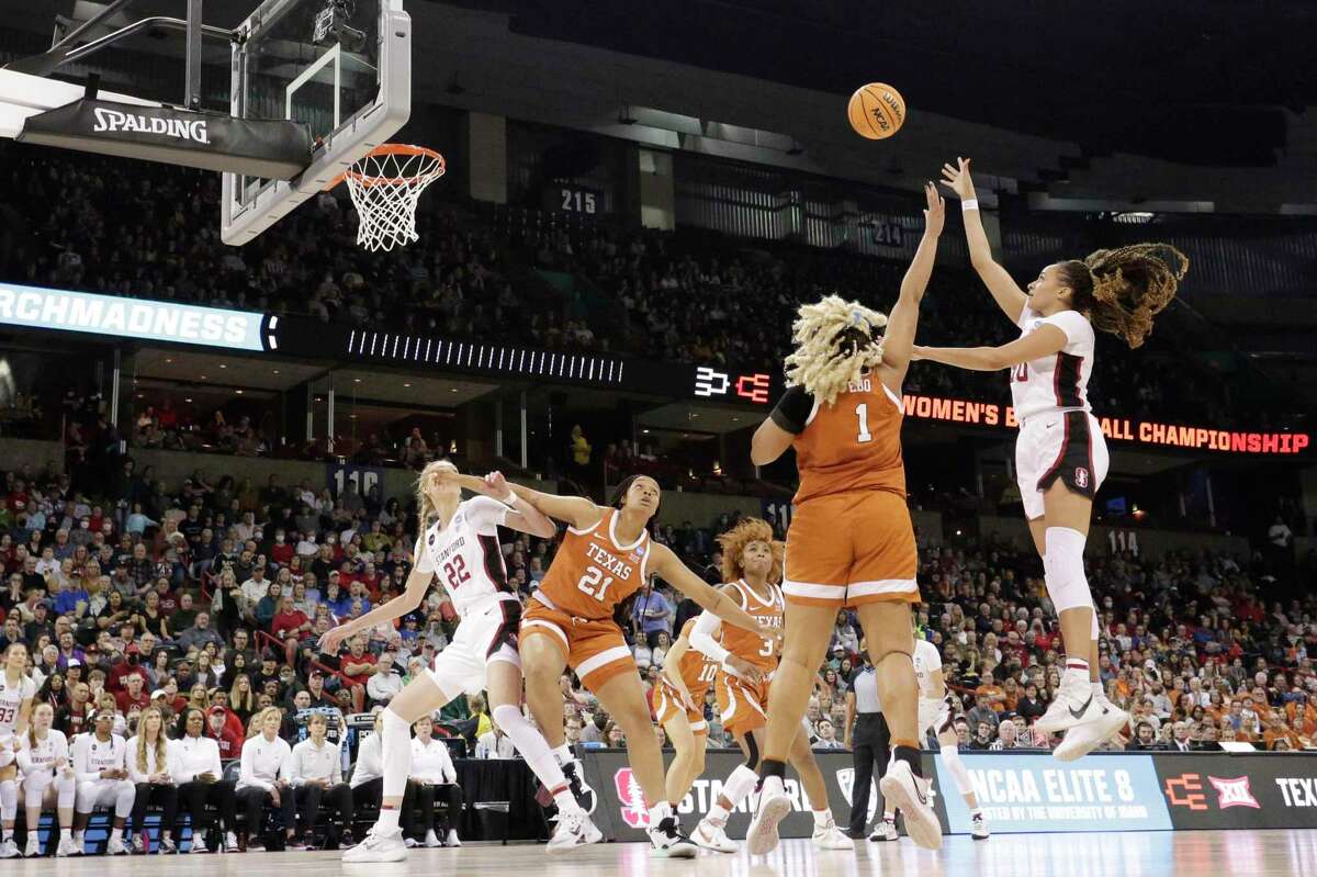 Stanford guard Haley Jones, right, shoots over Texas center Lauren Ebo (1) during the second half of a college basketball game in the Elite 8 round of the NCAA tournament, Sunday, March 27, 2022, in Spokane, Wash. (AP Photo/Young Kwak)
