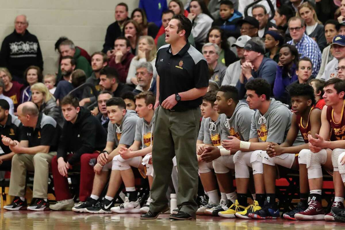 St. Joseph Head Coach Kevin Wielk communicates with his players during the Division IV Semifinal game between St. Joseph High School Boys Varsity Basketball and New Canaan Boys Varsity Basketball on March 12, 2019 at Warde - Fairfield High School in Fairfield, CT. Wielk is out after four seasons as coach at St. Joseph.
