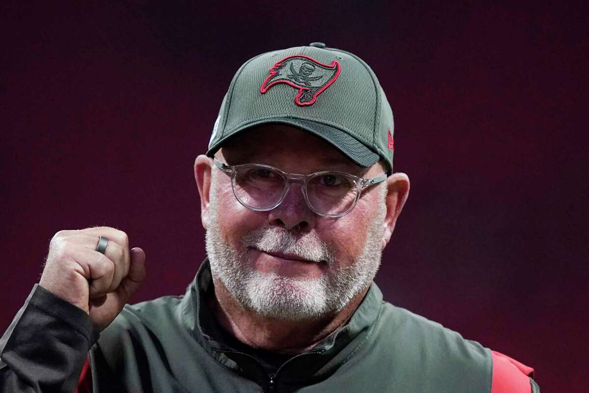 FILE - Tampa Bay Buccaneers coach Bruce Arians walks along the sideline before the team's NFL football game against the Atlanta Falcons on Dec. 5, 2021, in Atlanta. Arians has decided to retire as coach of the Buccaneers and move into a front-office role with the team, it was announced Wednesday night, March 30. Arians, who will turn 70 this coming season, coached the Bucs to the Super Bowl title in the 2020 season — Tom Brady’s first with Tampa Bay. (AP Photo/Brynn Anderson, File)