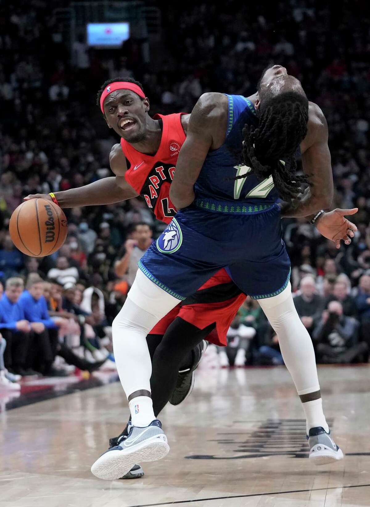 Toronto forward Pascal Siakam collides with Minnesota forward Taurean Prince. Siakam had 13 assists in the win.