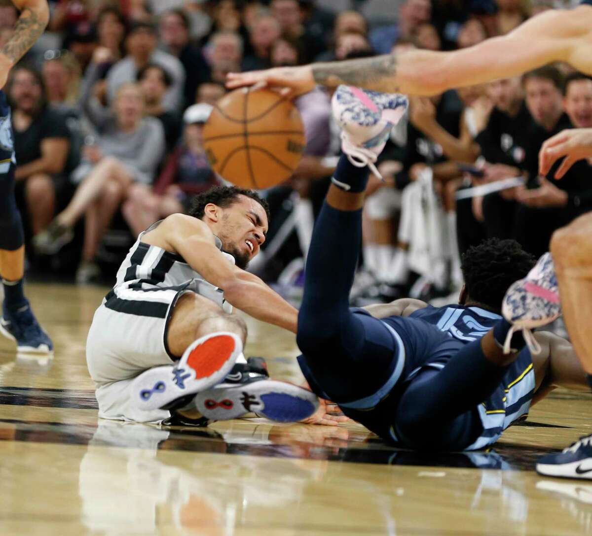 San Antonio Spurs guard Tre Jones (33) is fouled by Memphis Grizzlies Jaren Jackson Jr. (13) in second half. Memphis Grizzlies defeated the San Antonio Spurs 112-111on Wednesday, March 30, 2022 at the AT&T Center.