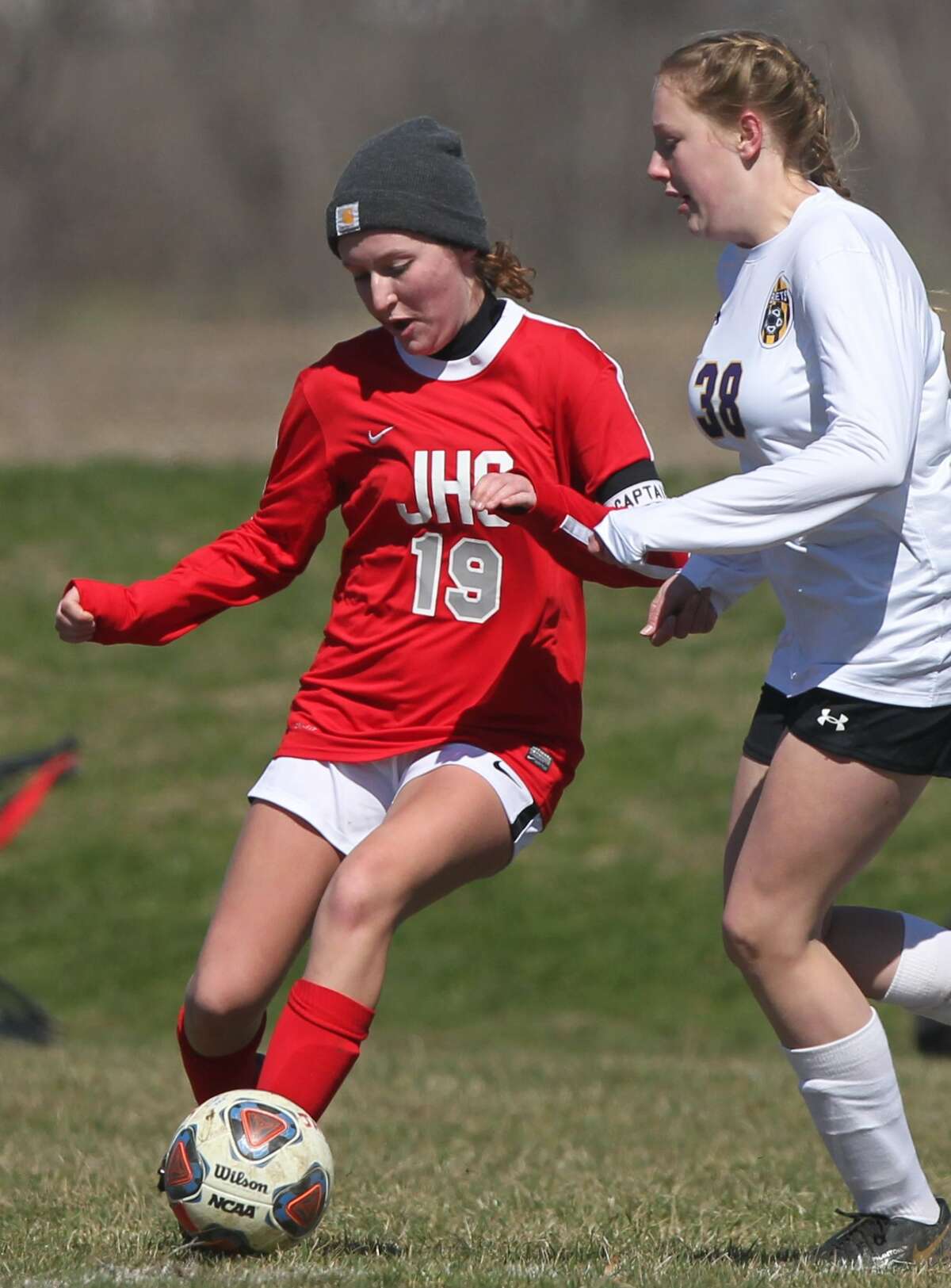 Jacksonville's Norah Pevey passes the ball during a girls' soccer game against Williamsville on Saturday.