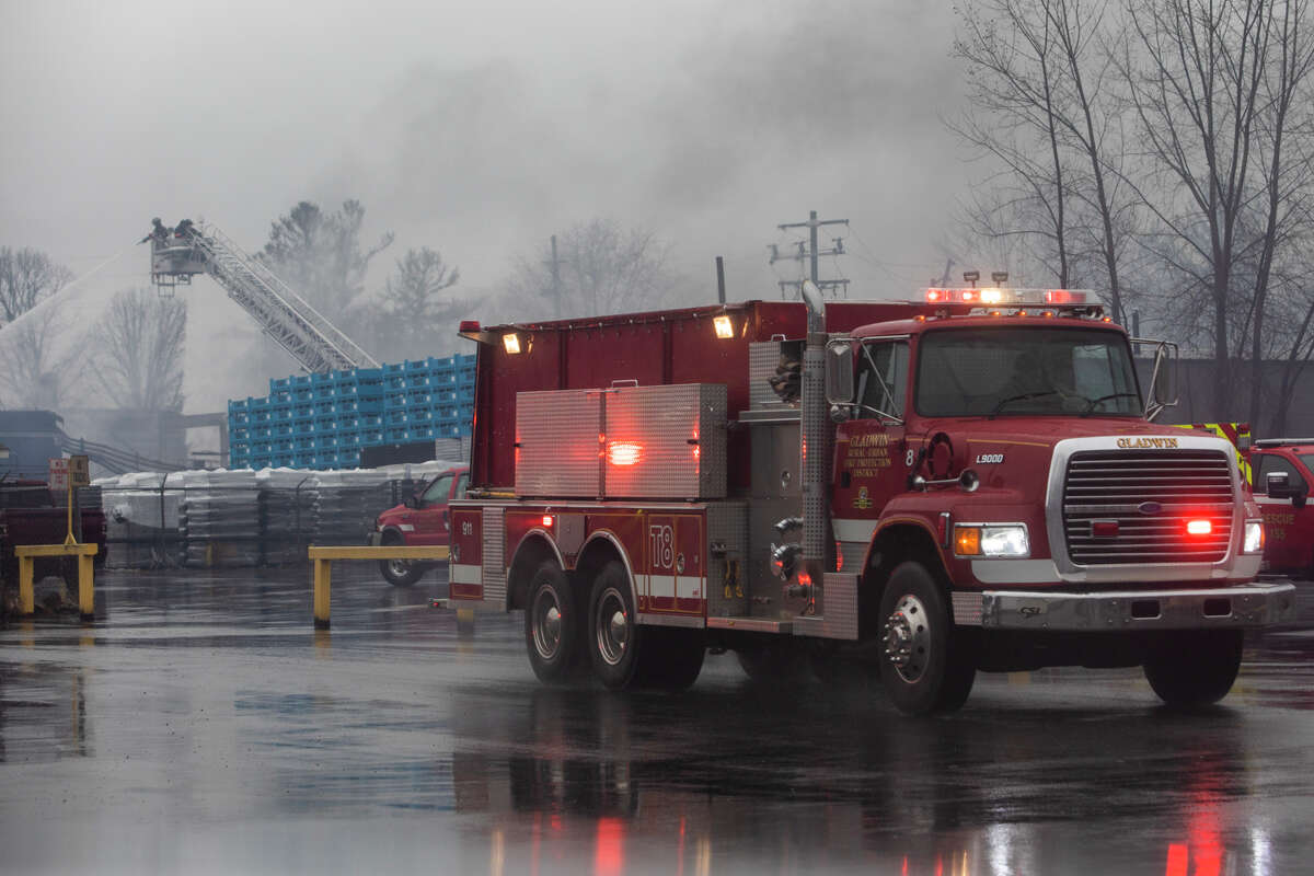 Firefighters from Coleman, Beaverton, Gladwin and Billings Township work to tame a fire at Robinson Industries, located at 3051 W. Curtis Road in Coleman, Thursday, March 31, 2022.