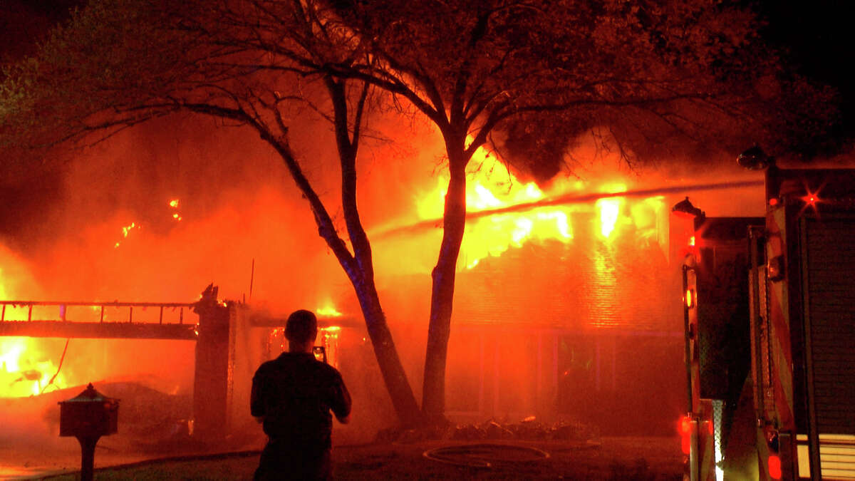 The home was completely engulfed in flames when firefighters arrived.
