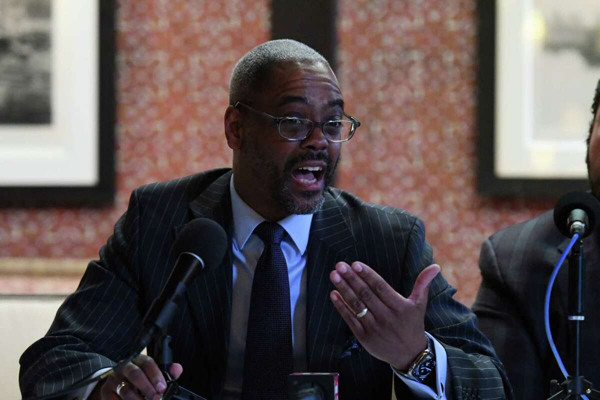 Marcus Pryor leads a panel of community leaders supporting University at Albany men’s basketball head coach Dwayne Killings on Thursday, March 31, 2022, during a news conference at the Fort Orange Club in Albany, N.Y. UAlbany is investigating an alleged incident between Killings and a player that took place before a road game in late November.