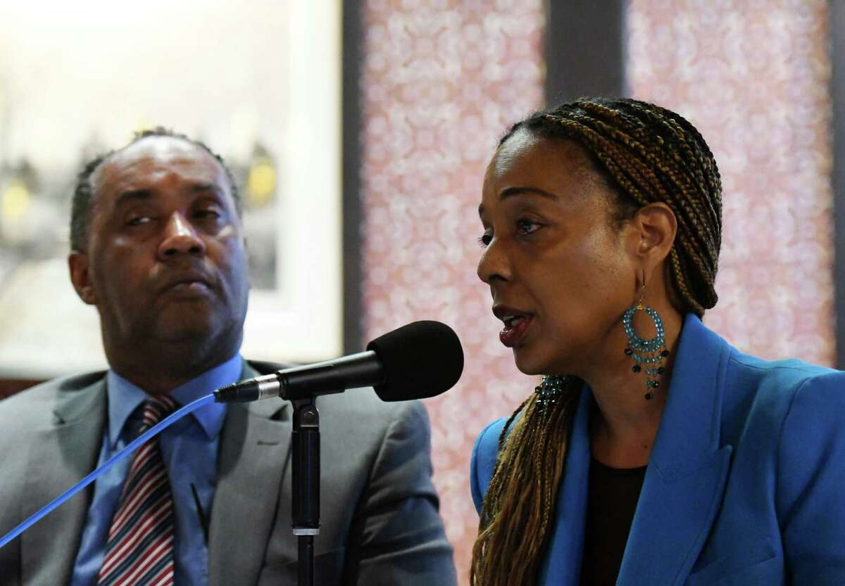 Anthony Gaddy, left, CEO of the Upstate NY Black Chamber of Commerce, and Kathleen McLean, president/CEO of the McLean Group, speak out in support of University at Albany men’s basketball head coach Dwayne Killings on Thursday, March 31, 2022, during a news conference at the Fort Orange Club in Albany, N.Y. UAlbany is investigating an alleged incident between Killings and a player that took place before a road game in late November.