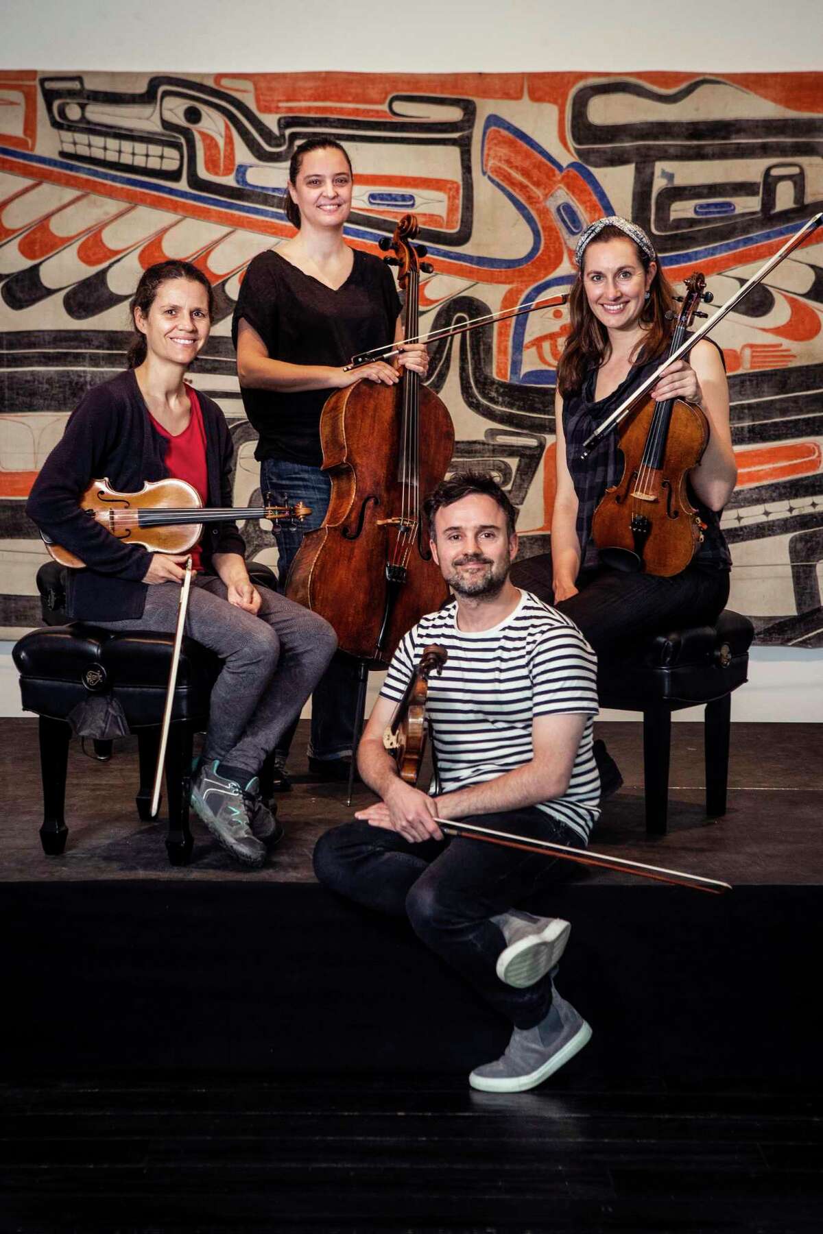 The Elias String Quartet, clockwise from left, Sara Bitlloch, Marie Bitlloch, Simone van der Giessen, and Donald Grant, pose for a portrait at The Menil Collection Tuesday, March 29, 2022 in Houston. The Elias String Quartet's Houston visit is unique among its stops around the United States. The quartet has been making stops around the country, doing curated performances of Beethoven's string quartet works. But Houston's Da Camera decided a 6-night series of performances would be a way to distinguish the Elias' shows from those in other markets.