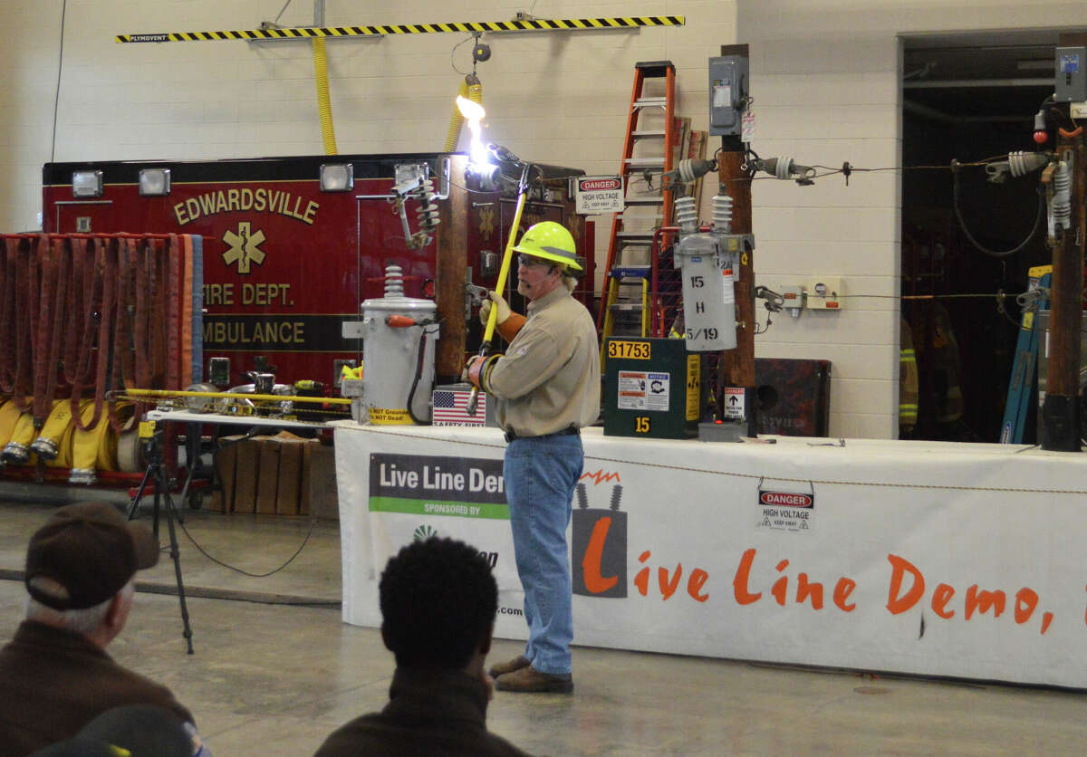 Steve Hancock sparks a live wire at the Ameren Illinois live line power presentation on Thursday. 