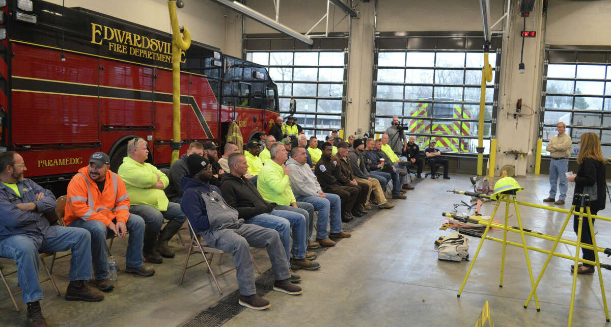 Local first responders listen to the live line demo presentation by Ameren Illinois on Thursday.