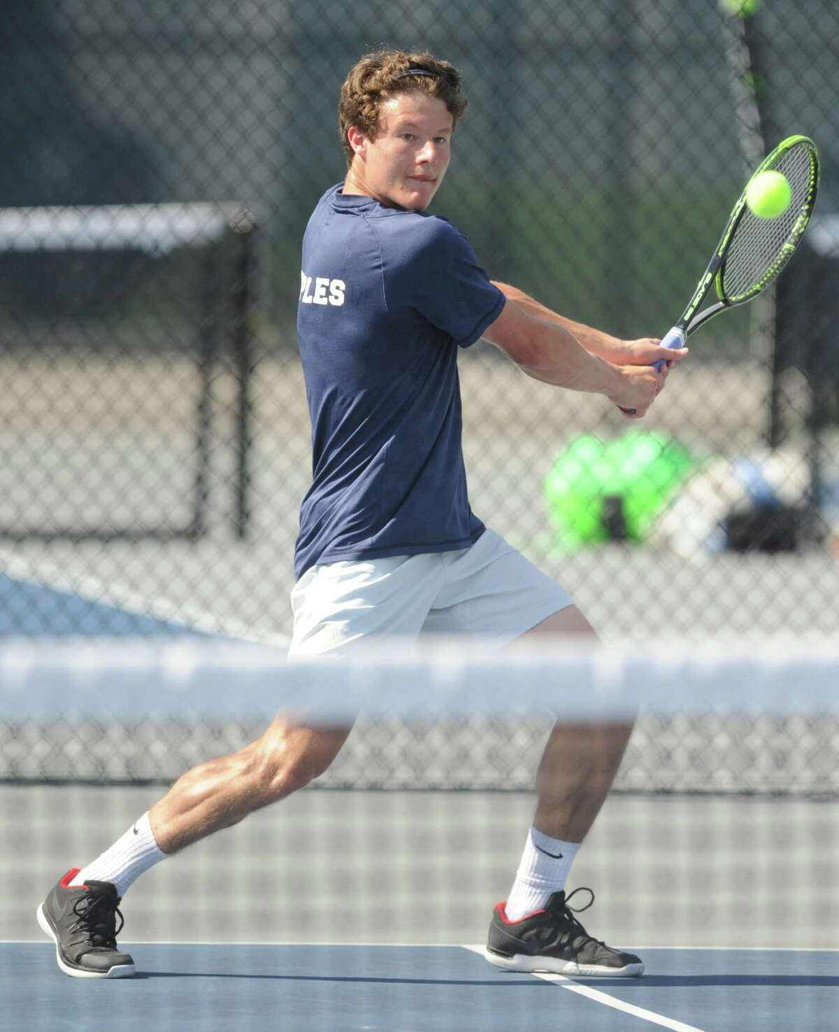 Staples' Evan Felcher competes in his No.1 singles win against Justin Speaker in the FCIAC high school boys tennis championship between Greenwich and Staples at Wilton High School in Wilton, Conn. Wednesday, May 23, 2018.