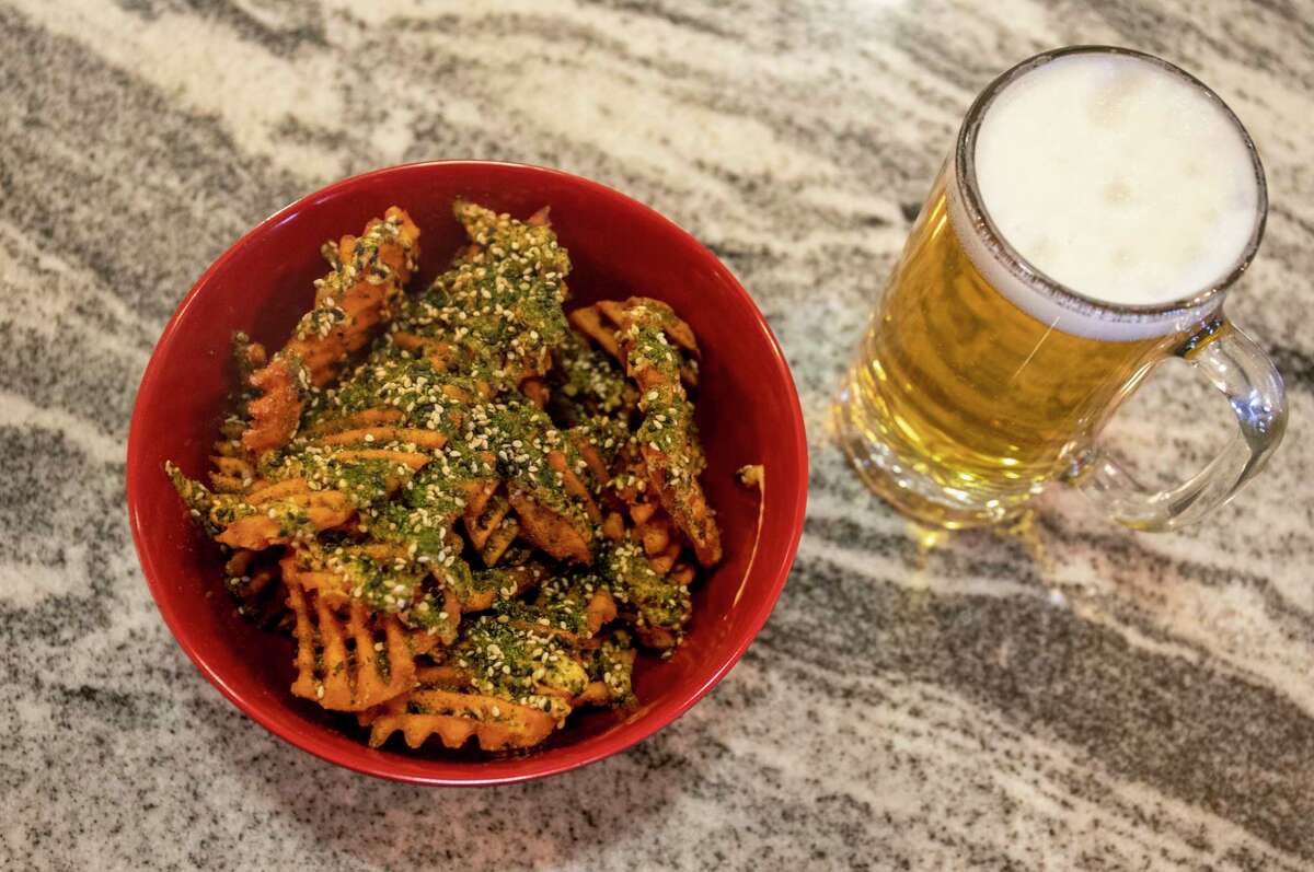 Mister Chip’s Kitchen and Bar's sweet potato fries with Altstadt Kolsch from Fredericksburg as seen Thursday, March 31, 2022 at 607 N. Colorado St. Jacy Lewis/Reporter-Telegram