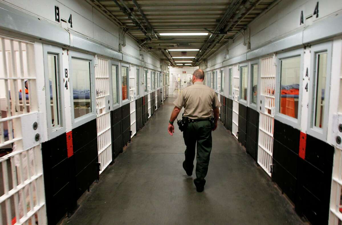 A guard walks through the San Francisco County Jail facility in this 2012 photo.