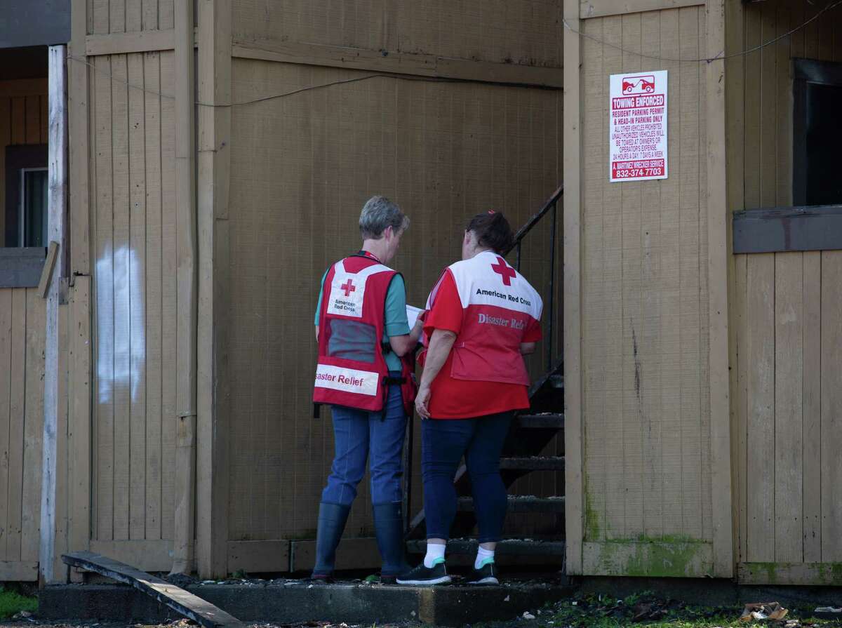 American Red Cross workers assessing to help residents who are displaced from a two-alarm apartment fire on 5800 block of North Houston Rosslyn Road Thursday, March 31, 2022, in Houston. A fire in the laundry room was reported shortly around 2:44 p.m., HFD PIO Abby Cortez said. No resident was injured but one firefighter suffered injury and was transported to area hospital.