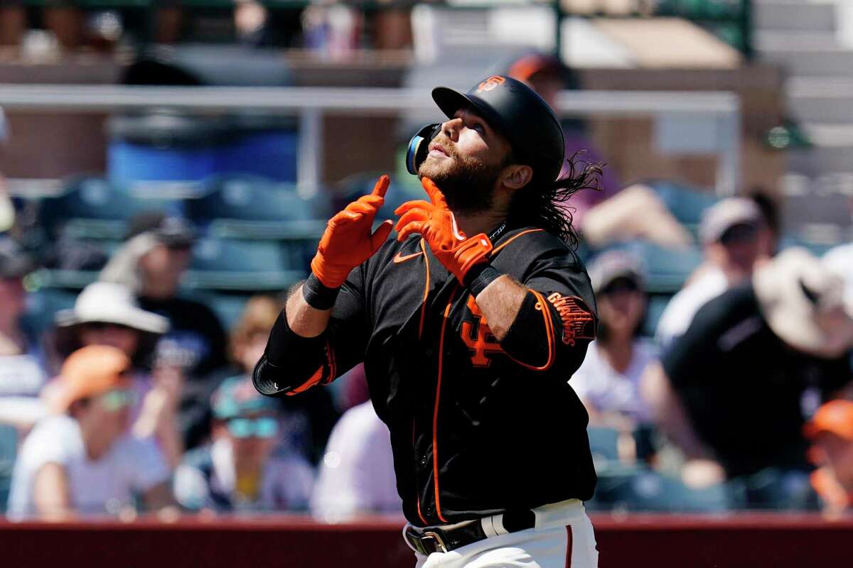 San Francisco Giants' Brandon Crawford looks to the sky as he rounds the bases after hitting a home run against the Colorado Rockies during the first inning of a spring training baseball game Thursday, March 31, 2022, in Scottsdale, Ariz. (AP Photo/Ross D. Franklin)