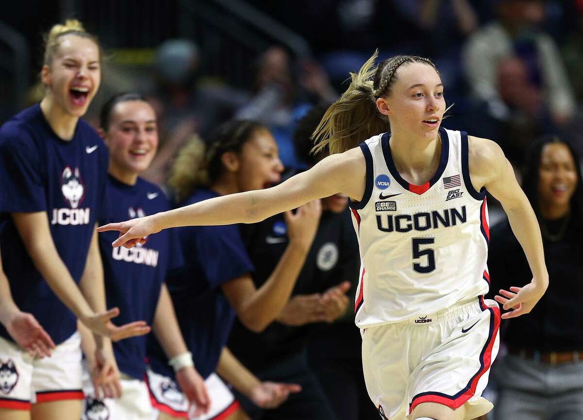 BRIDGEPORT, CONNECTICUT - MARCH 26: Paige Bueckers #5 of the UConn Huskies celebrates her three point shot in the second half against the Indiana Hoosiers during the Sweet Sixteen round of the NCAA Women's Basketball Tournament at Total Mortgage Arena at Harbor Yard on March 26, 2022 in Bridgeport, Connecticut. (Photo by Elsa/Getty Images)