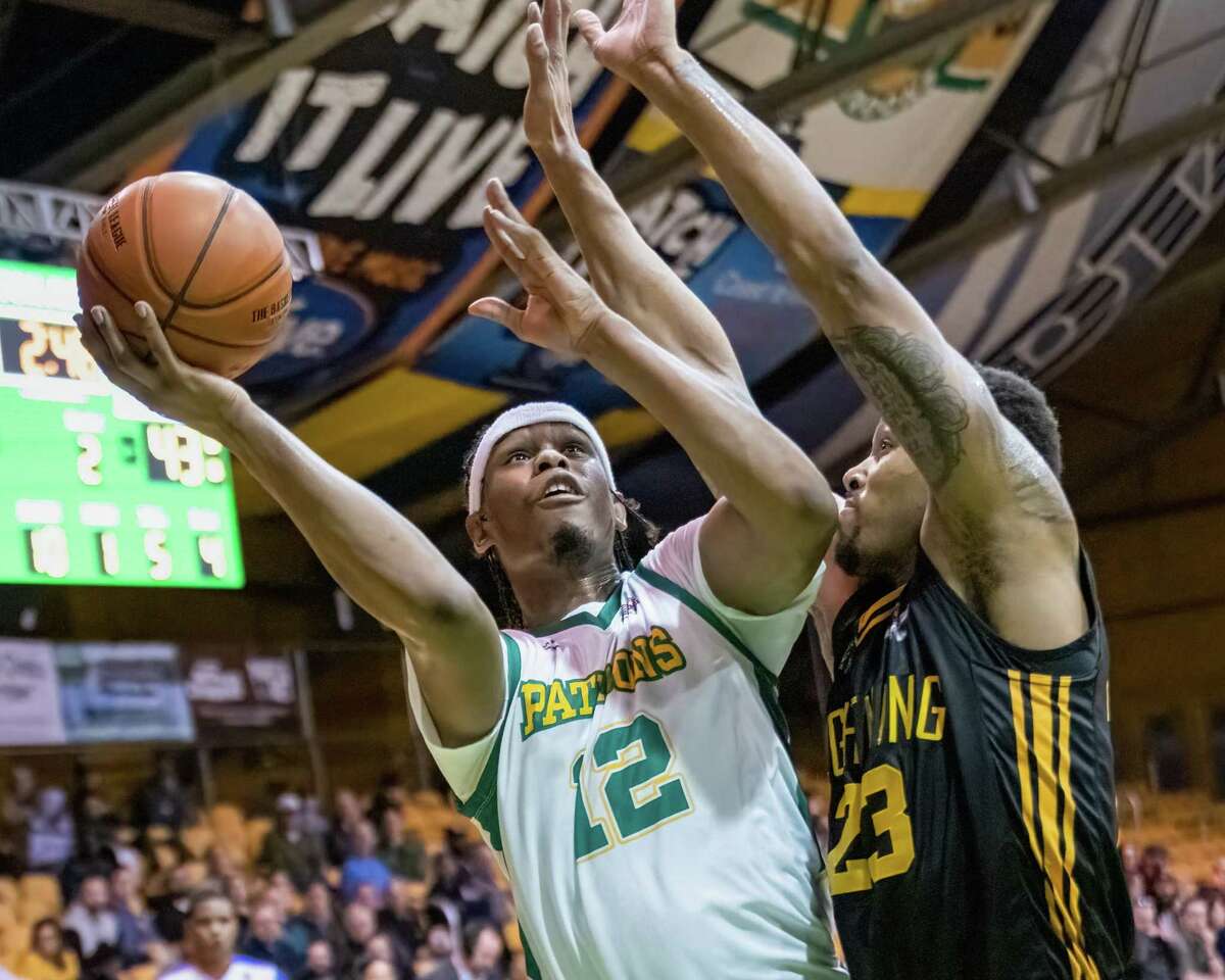 Albany Patroons center Jared Sam goes up against London Lightning center Amir Williams during a game at Washington Avenue Armory in Albany on Thursday, March 31, 2022. (Jim Franco/Special to the Times Union)