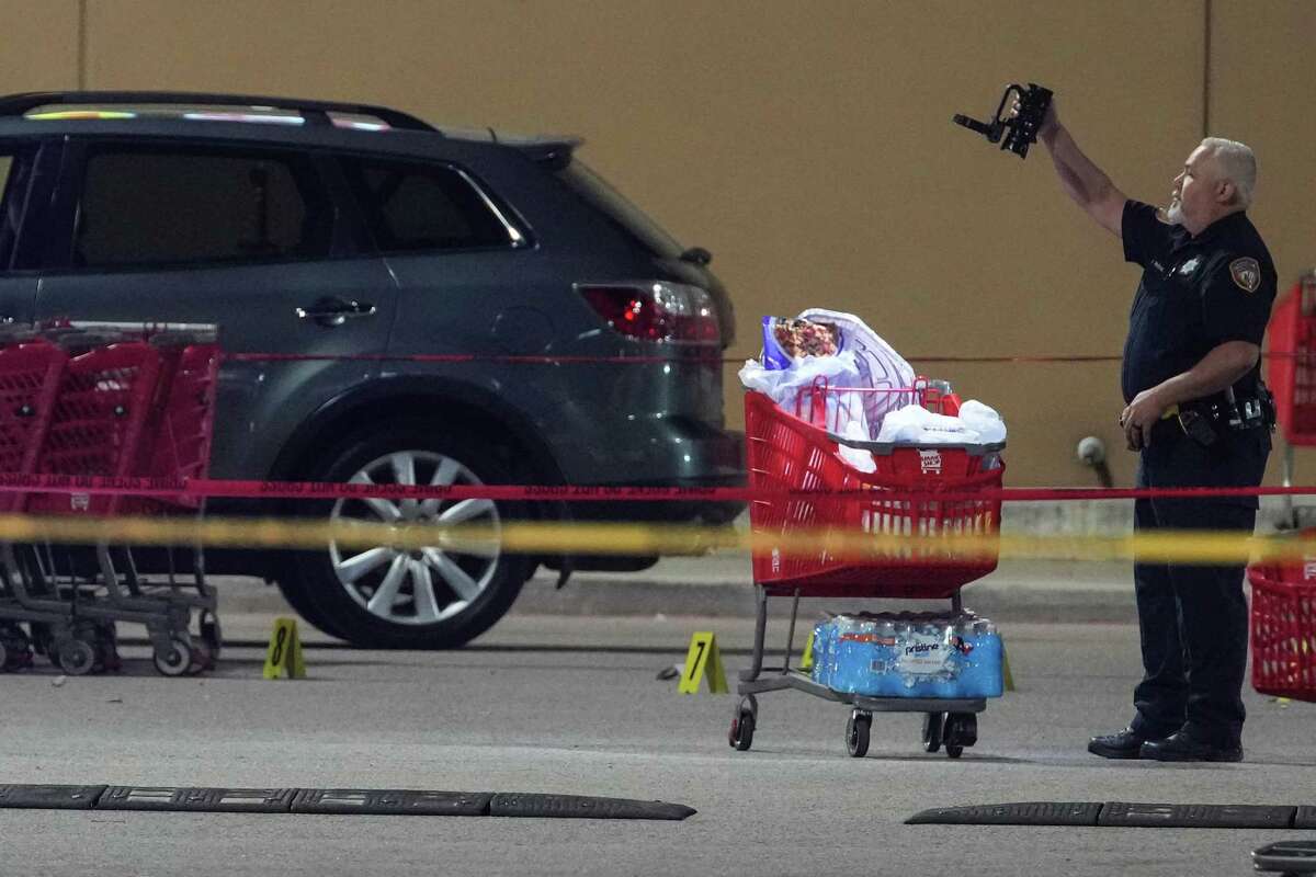 Law enforcement officers investigate the scene of an officer-involved shooting in the parking lot of a grocer store at 2929 FM 1960 near Aldine Westfield Thursday, March 31, 2022 in Houston. An off-duty Harris County Sheriff's Office deputy was shot in north Harris County when gunfire broke out between the deputy and people “committing a criminal offense,” according to Sheriff Ed Gonzalez. The sheriff wrote in a tweet that, “as the deputy approached, the males opened fire and our deputy returned fire.” The deputy, who was struck, was transported in critical condition, Gonzalez wrote.