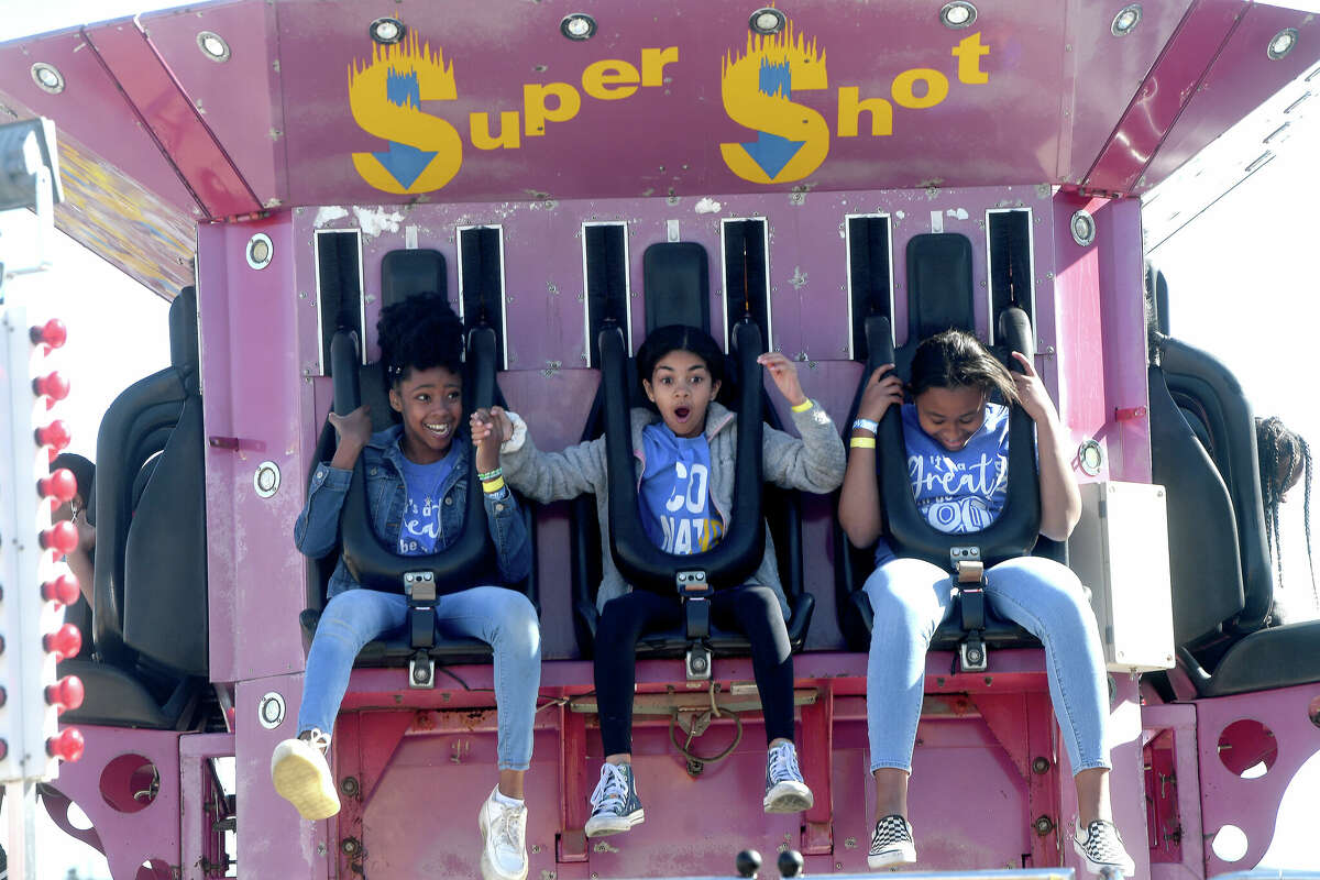 Students react as they take a ride on the Super Shot on BISD's Fair Day at the YMBL South Texas State Fair Thursday. Nearly 2,500 elementary and middle schoolers converged on the fairgrounds for their first district-wide fair event. Photo made Thursday, March 31, 2022 Kim Brent/The Enterprise