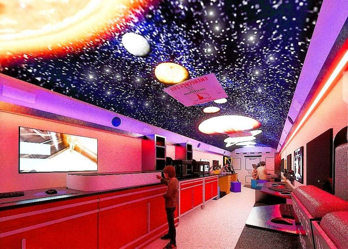 An Alvin ISD school bus is being retrofitted to create a mobile STEM lab. The inside of the bus is a lightbox, and on the ceiling is a mural of the solar system where each planet can be individually highlighted.