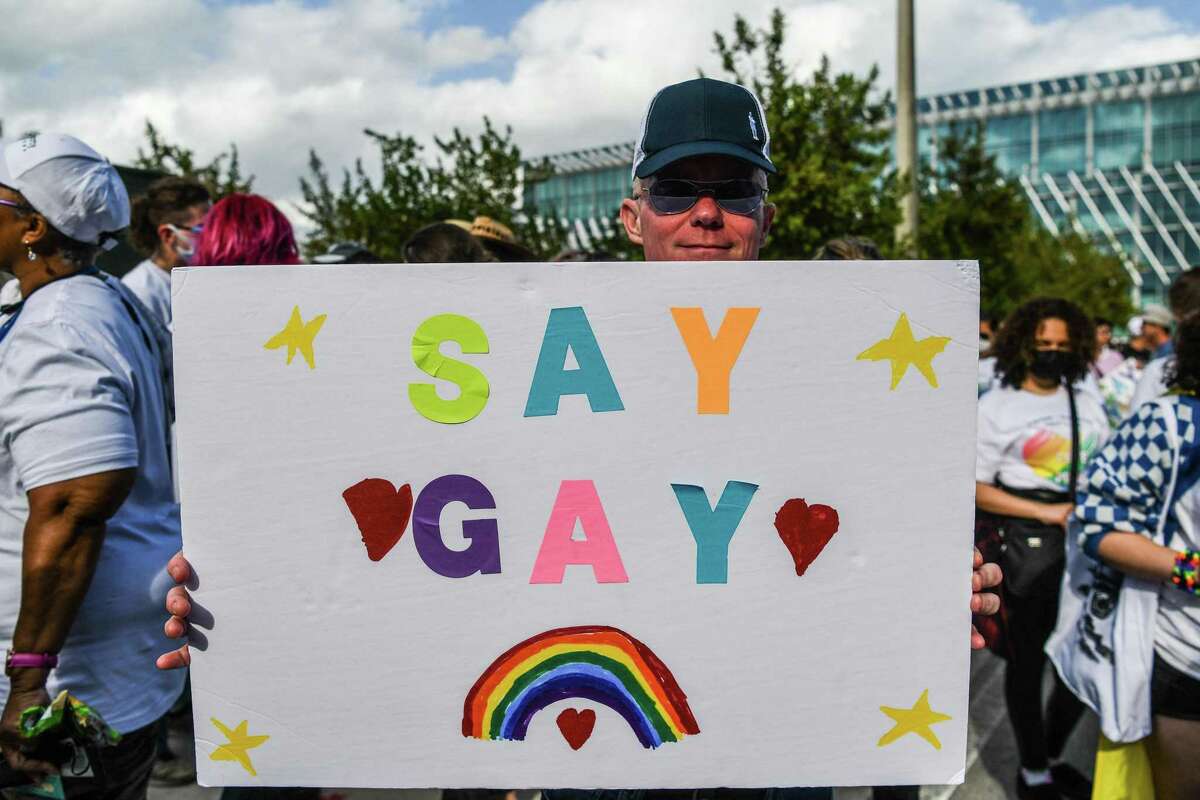 Members and supporters of the LGBTQ community attend the “Say Gay Anyway” rally in Miami Beach, Fla., on March 13.