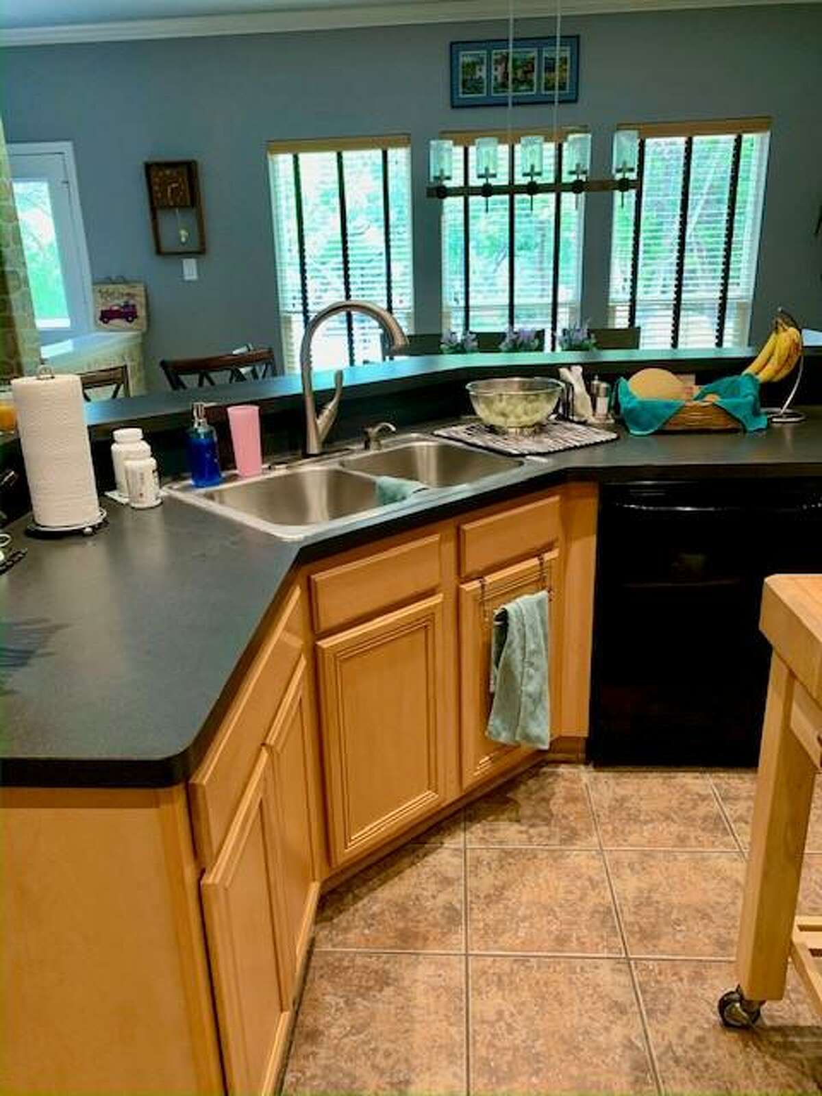 The original center island in Penny and Don Wuebben's Helotes Kitchen wasn’t square or even rectangular. Instead it had several 45-degree angles and the counter along one side was raised 6 inches higher than the rest of it.