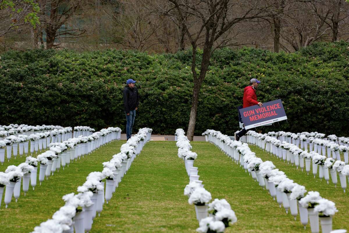 Thousands of white flowers are placed aligned and all white to draw attention to gun violence, Monday, March 7, 2022, in Houston.