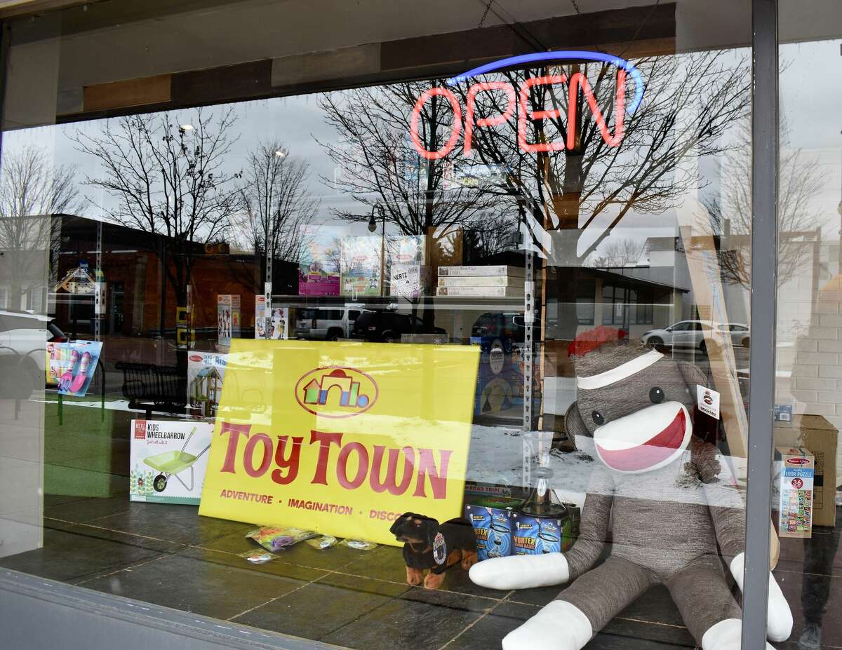 Toy Town's grand opening in downtown Reed City featured a variety of children's toys, a coloring and painting station, a play mat complete with a slide, and a special visitor in Santa who talked all things toys with the kids in attendance. 