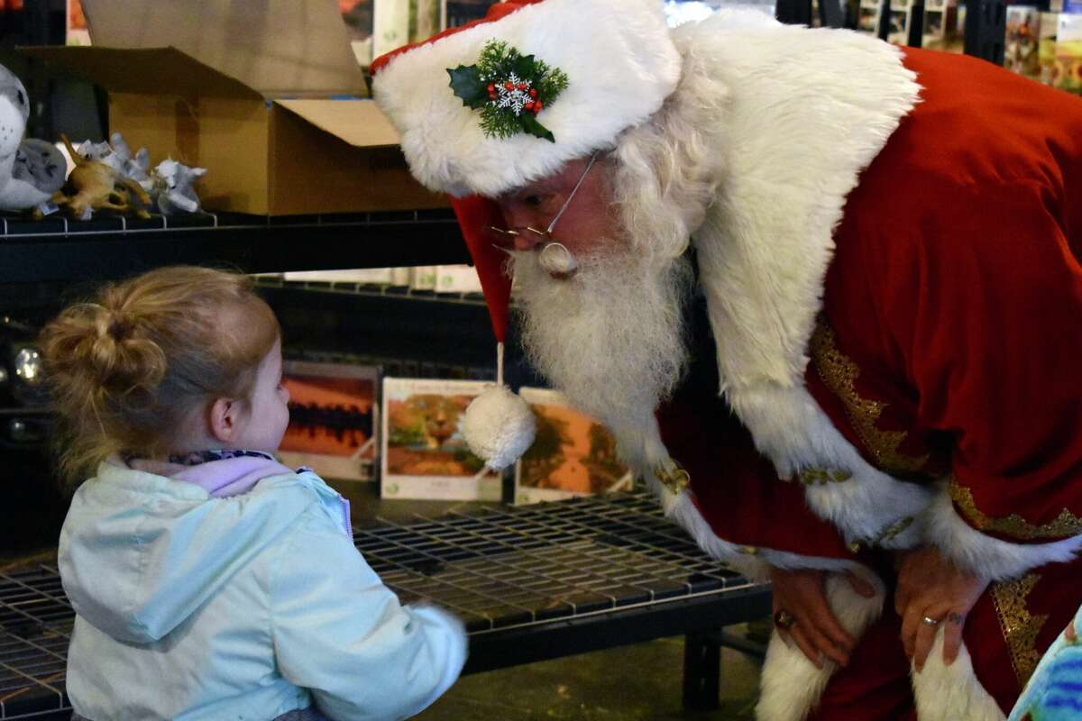 Toy Town's grand opening in downtown Reed City featured a variety of children's toys, a coloring and painting station, a play mat complete with a slide, and a special visitor in Santa who talked all things toys with the kids in attendance.