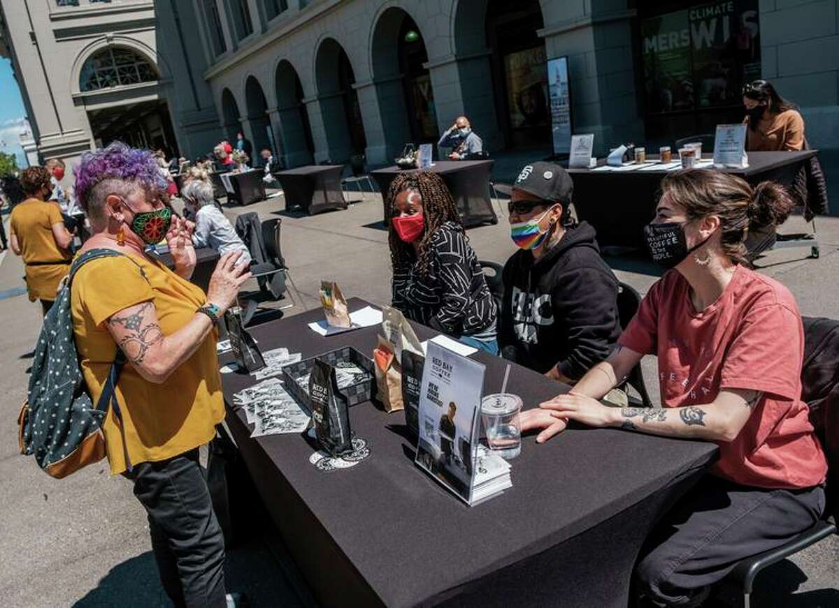 Janette Rosales (left) attends a job fair for San Francisco Ferry Building businesses in June.