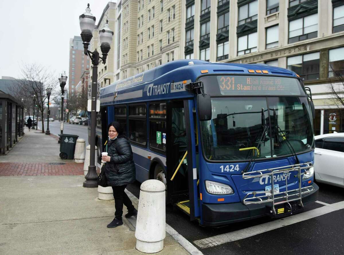 Stamford's Michelle Darden gets off the 331 bus on Main Street in Stamford, Conn. Thursday, March 31, 2022. Connecticut Gov. Ned Lamont announced a bus holiday alongside the gas tax holiday he signed into effect this month.