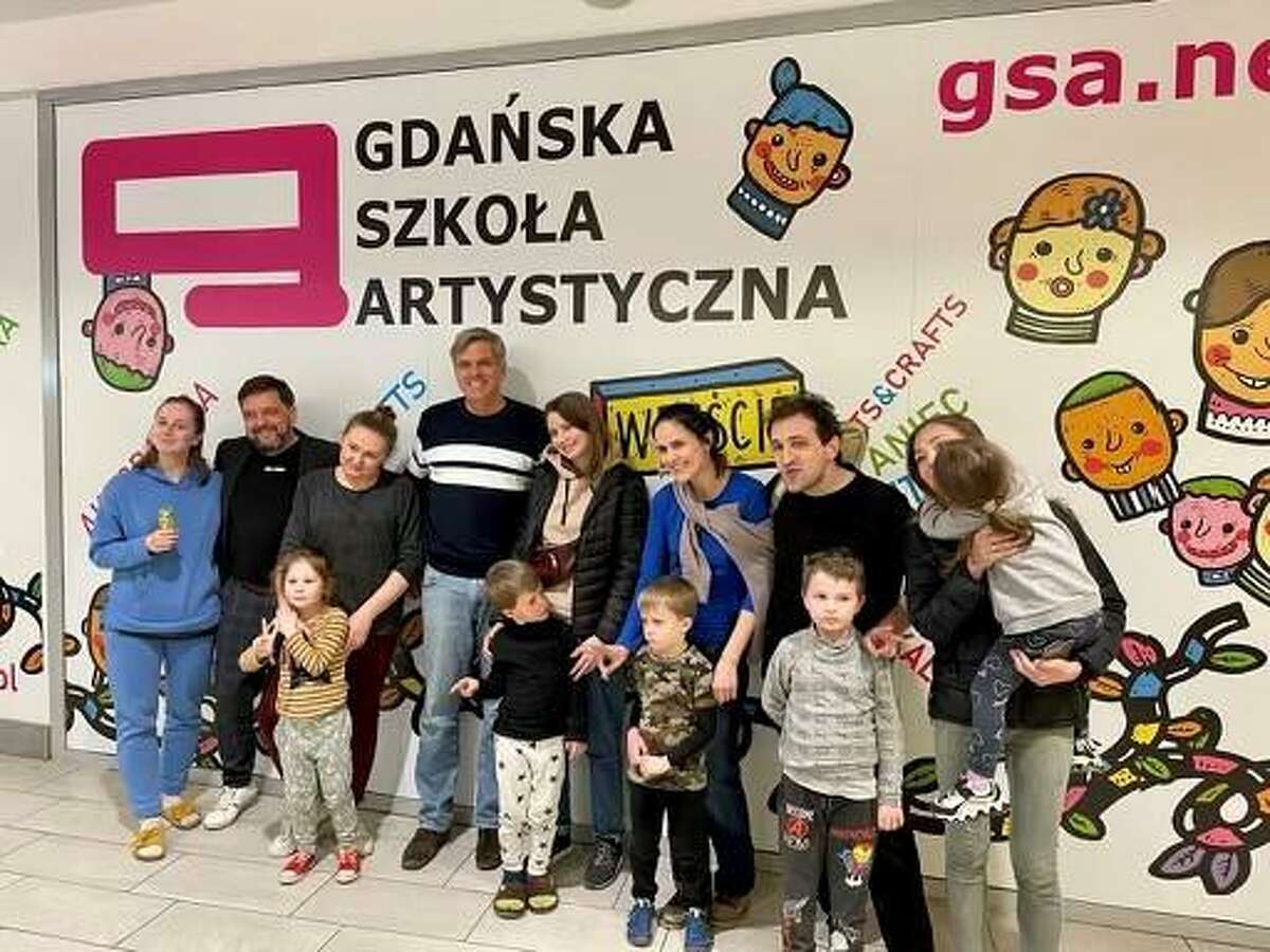 Bob Stefanowski, Republican candidate for governor, center left, stands with Ukrainian refugees at a school in Gdansk, Poland, during a visit to the country the week of March 28, 2022.