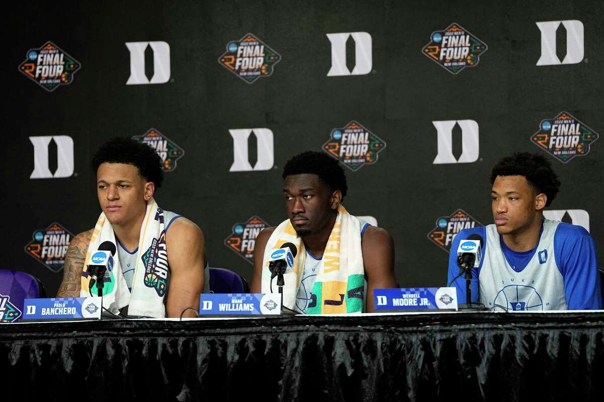 Duke's Paolo Banchero, left, Mark Williams, center, and Wendell Moore Jr. listen to a question during a news conference at the men's Final Four NCAA college basketball tournament Thursday, March 31, 2022, in New Orleans. North Carolina will play Duke Saturday. (AP Photo/David J. Phillip)