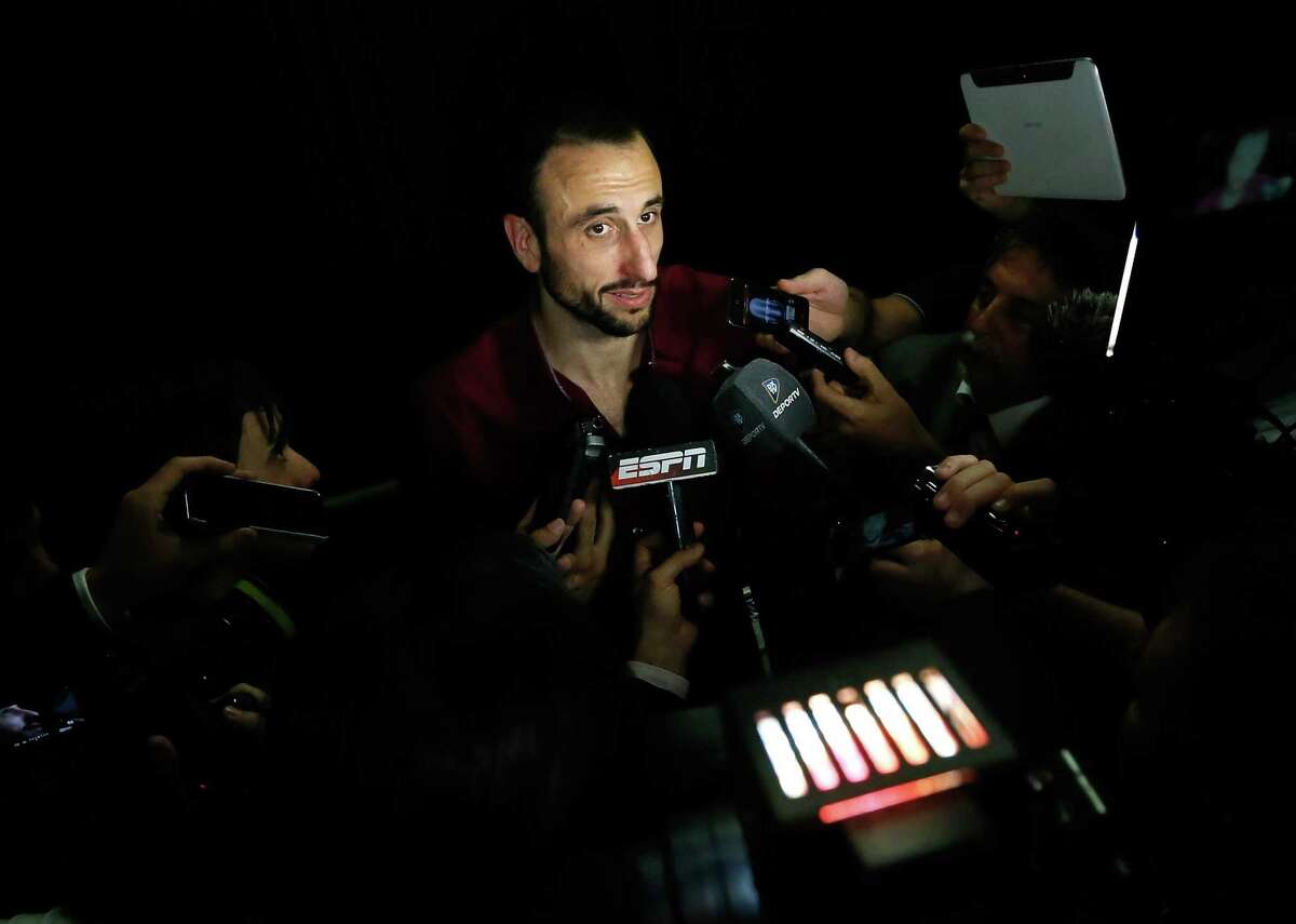MIAMI, FL - JUNE 20: Manu Ginobili #20 of the San Antonio Spurs answers questions after losing to the Miami Heat 95-88 in Game Seven of the 2013 NBA Finals at AmericanAirlines Arena on June 20, 2013 in Miami, Florida. NOTE TO USER: User expressly acknowledges and agrees that, by downloading and or using this photograph, User is consenting to the terms and conditions of the Getty Images License Agreement. (Photo by Kevin C. Cox/Getty Images)