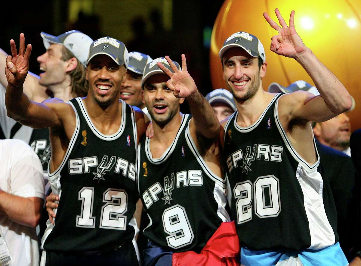 Spurs' forward Bruce Bowen (12) guard Tony Parker, of France, (09) and guard Manu Ginobili, of Argentina, (20) celebrate after sweeping the Cavaliers in game 4 in the NBA Finals at the Quicken Loans Arena Thursday June 14, 2007, in Cleveland, OH. (EDWARD A. ORNELAS/STAFF)