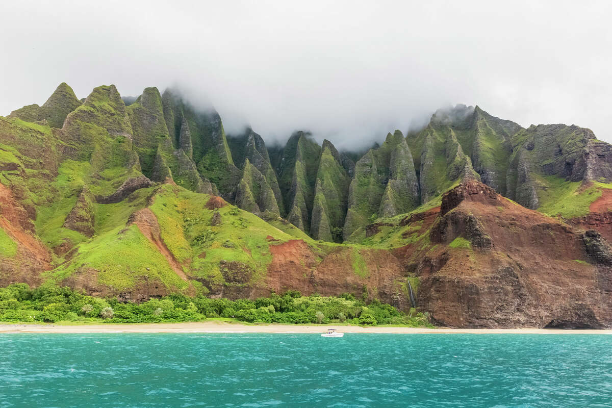 In the 1950s and early '60s, Dr. Bernard Wheatley found a home in a cave (far right) on Kalalau Beach at the end of the Kalalau Trail.