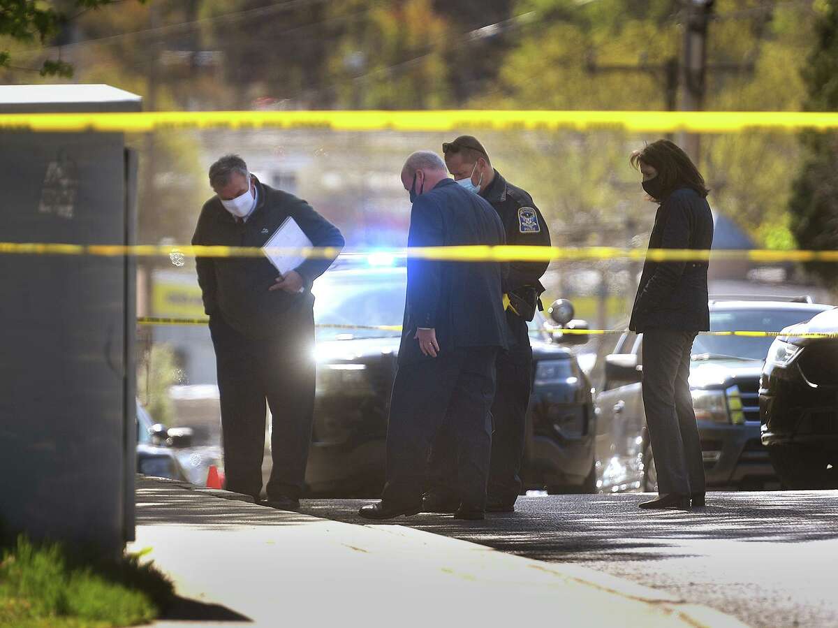 The scene of a 7 a.m. police shooting involving a Derby police officer on Division Street in Ansonia, Conn. on Monday, April 26, 2021. Division Street marks the border between Ansonia and Derby.