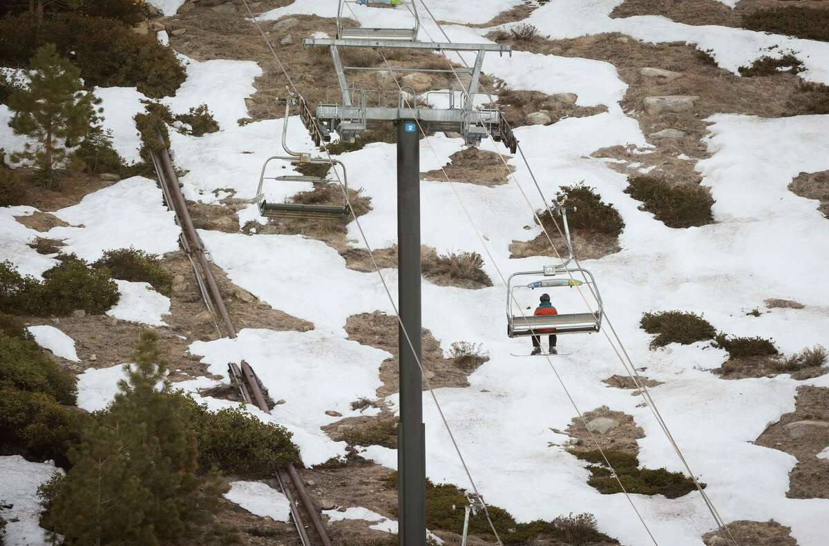 A skier rides a lift at Heavenly Mountain Resort in South Lake Tahoe on April 1. Statewide, snowpack measured only 38% of average for the date, typically the point in the year with maximum snowpack.