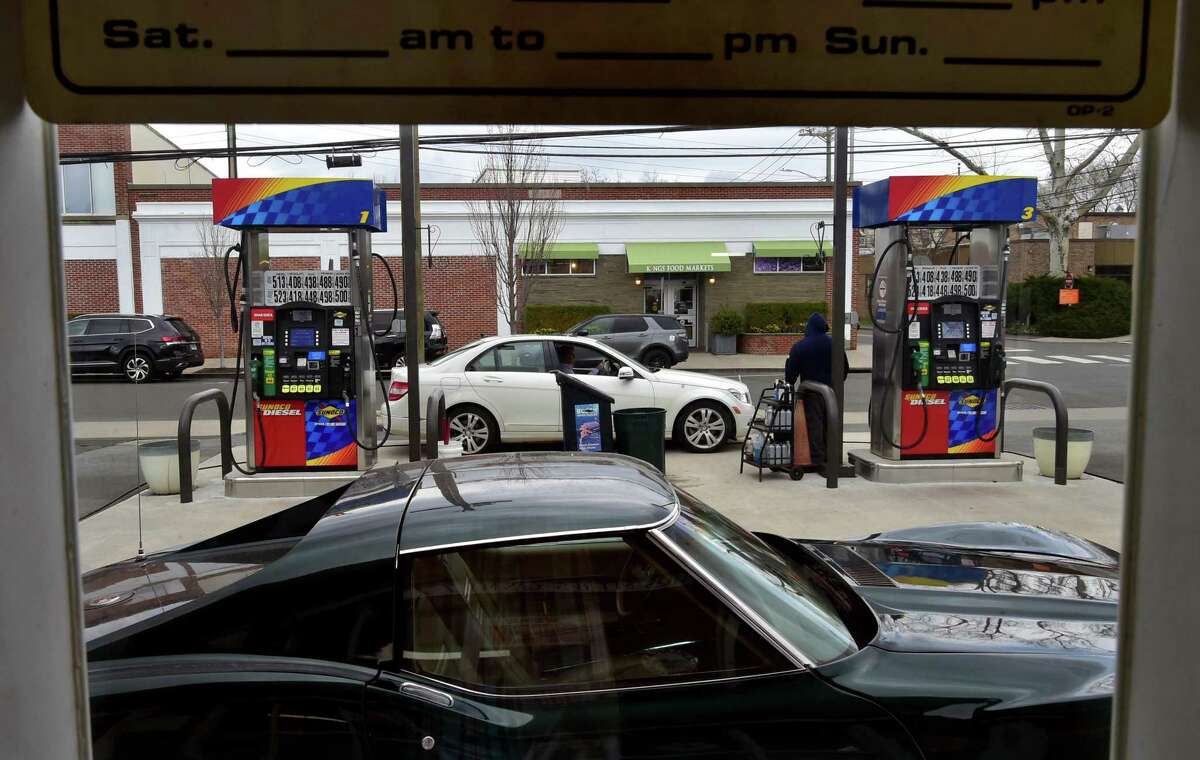 A customer pulls in for a fill up at Soundview Servicenter North in Old Greenwich, Conn., on Friday April 1, 2022. The state's gas tax holiday is in effect today, bring prices down 25 cents per gallon.