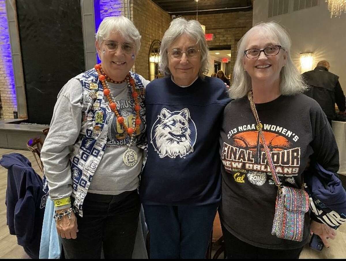 UConn fans Bonnie Emery, Diane Bancroft and Jan Hayton in Minneapolis for the the UConn-Stanford national semifinal game Friday April 1, 2022.
